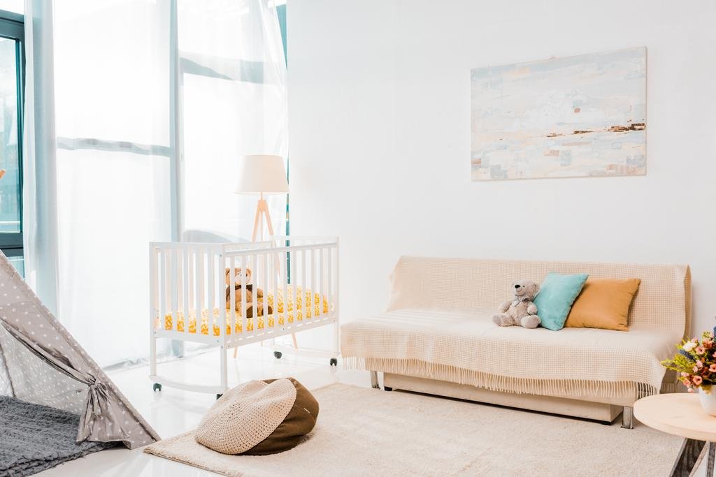 Modern interior design of nursing room with crib